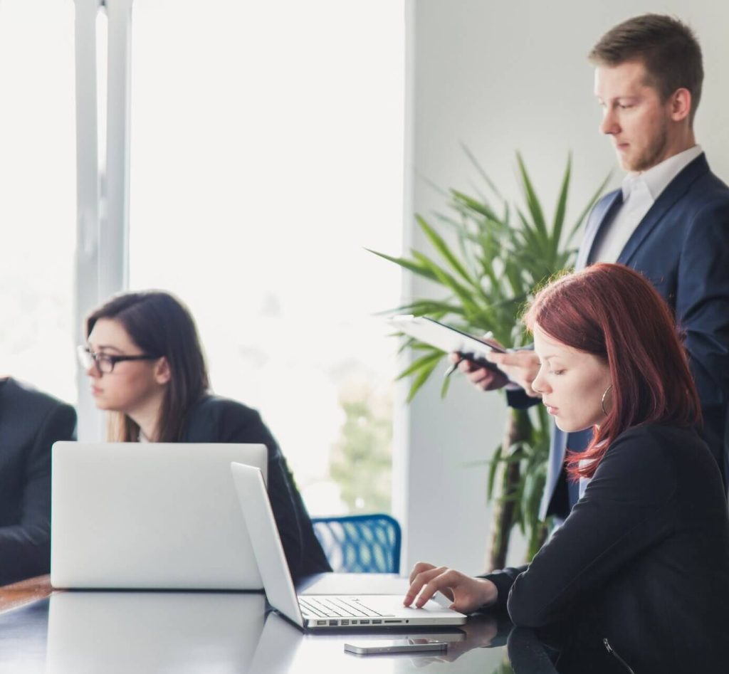 Employees reading RPZ Valve FAQs on a laptop
