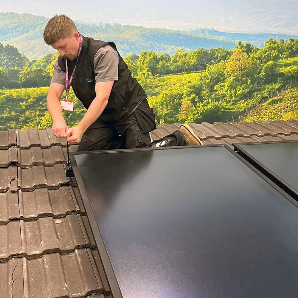 Lewis Elgey of Westwood Plumbign and Heating Ltd. attending to a Solar Thermal Servicing Training session with Grant UK in Swindon